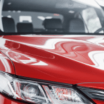 headlights-new-red-car-car-dealership
